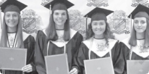 Graduates in caps and gowns hold diplomas, smiling in a black-and-white photograph.